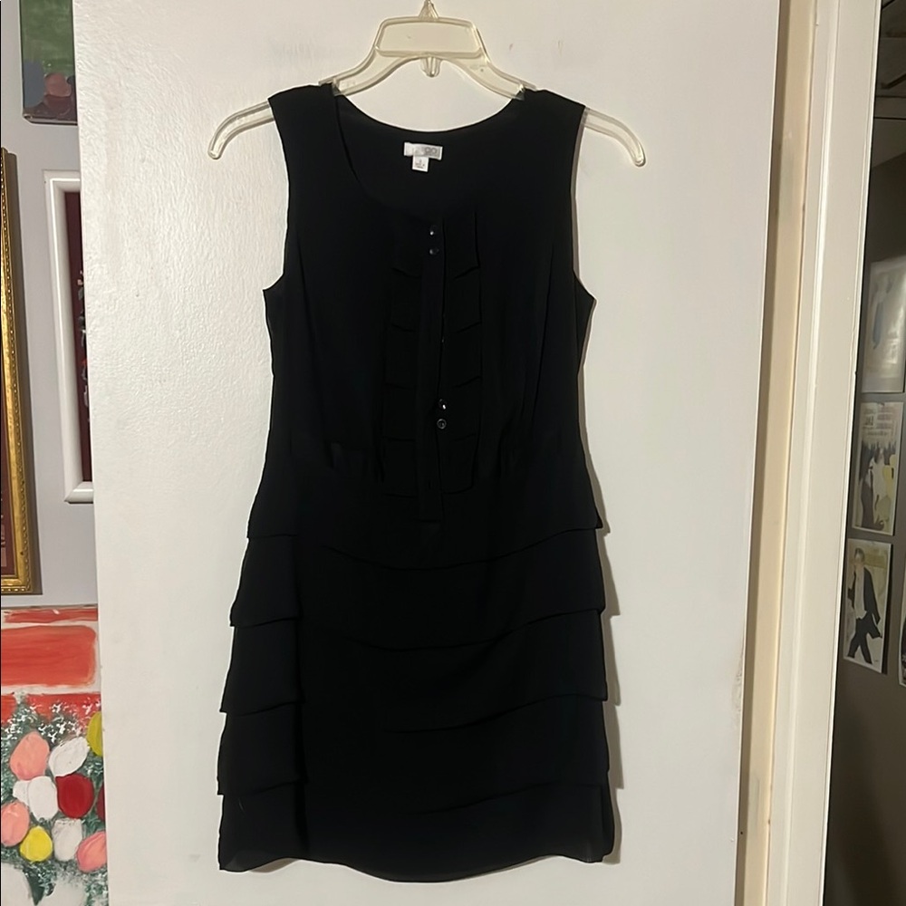 GO International Black Sleeveless Dress. Front button closure. Tiered detail